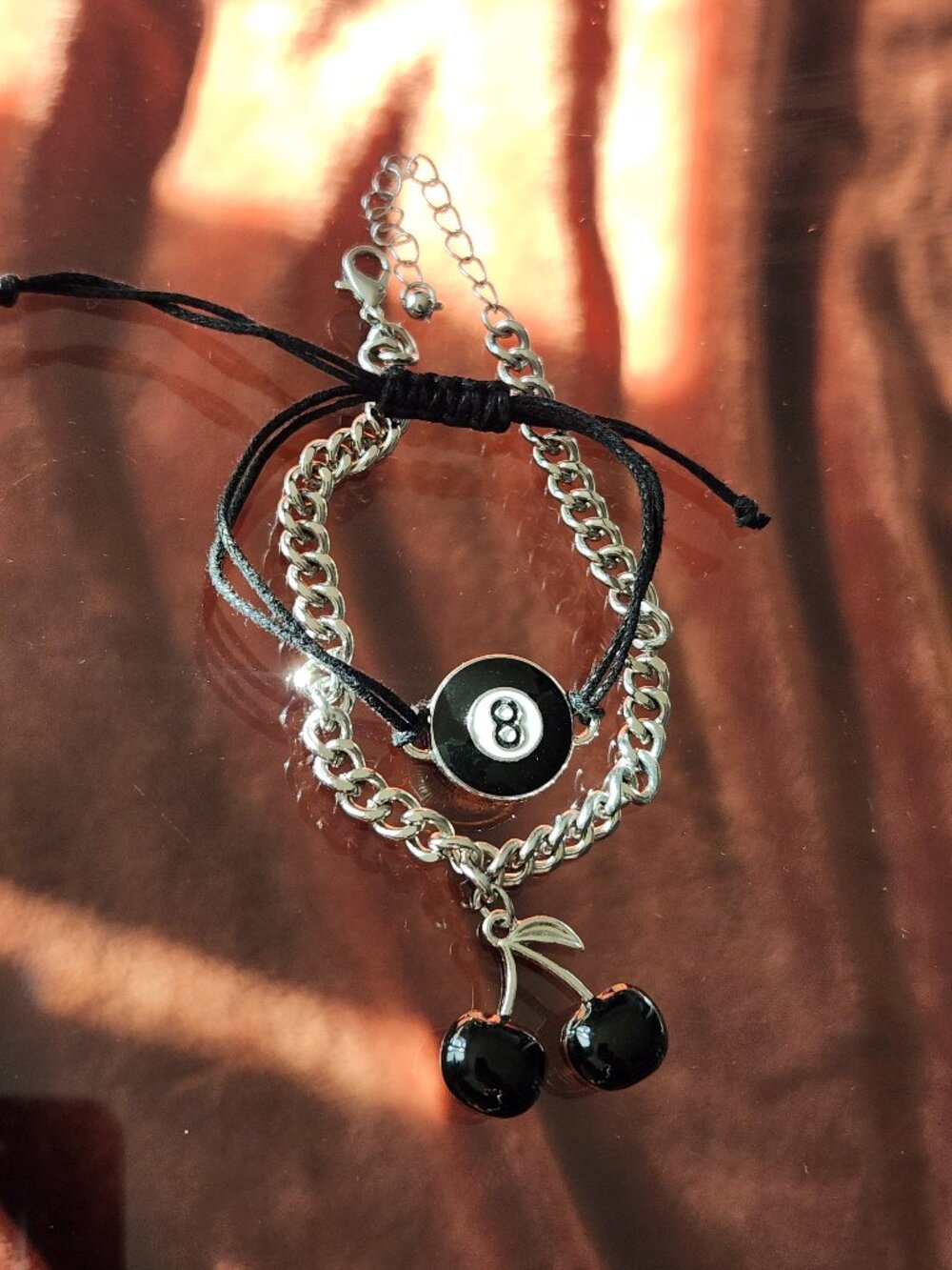 Body Rage 8-Ball and black cherry bracelet set.